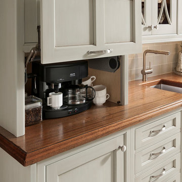 Kitchen with White Cabinets & Dark Wood Island