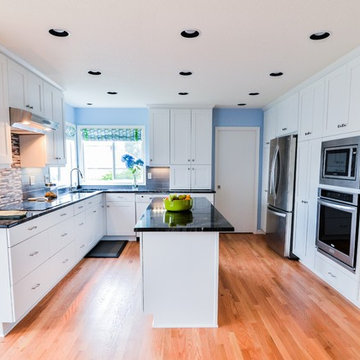 Kitchen with white painted shaker style cabinets