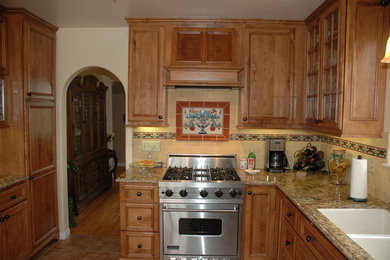 Example of a tuscan kitchen design in Orange County