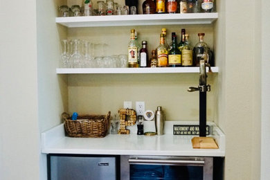 Photo of a home bar in Other with engineered stone countertops, multi-coloured splashback, ceramic splashback, porcelain flooring and brown floors.