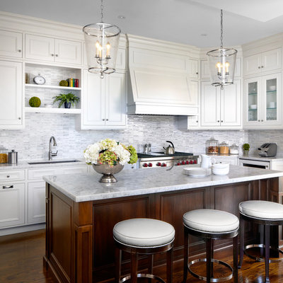 Elegant l-shaped dark wood floor kitchen photo in Toronto with an undermount sink, recessed-panel cabinets, white cabinets, multicolored backsplash, mosaic tile backsplash, stainless steel appliances and an island