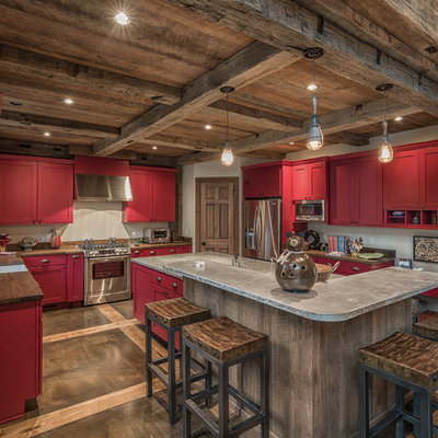 Open concept kitchen - mid-sized rustic u-shaped concrete floor open concept kitchen idea in Charlotte with a single-bowl sink, shaker cabinets, red cabinets, granite countertops, white backsplash, stainless steel appliances and an island