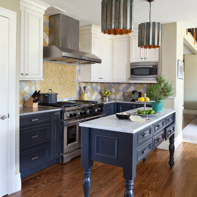 Kitchen - mid-sized traditional dark wood floor and brown floor kitchen idea in Denver with recessed-panel cabinets, multicolored backsplash, an island, blue cabinets, marble countertops, ceramic backsplash and stainless steel appliances