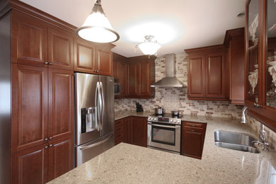 Eat-in kitchen - mid-sized traditional u-shaped eat-in kitchen idea in Montreal with raised-panel cabinets, brown cabinets, quartz countertops, beige backsplash, stone tile backsplash and a peninsula