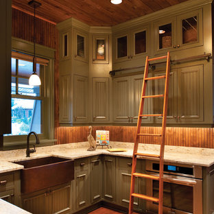 Photo of a mid-sized country u-shaped separate kitchen in Detroit with a farmhouse sink, louvered cabinets, green cabinets, granite benchtops, brown splashback, stainless steel appliances, medium hardwood floors, timber splashback and no island.