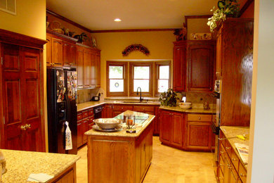 Inspiration for a kitchen remodel in Other with a double-bowl sink, beaded inset cabinets, light wood cabinets, beige backsplash, black appliances and an island