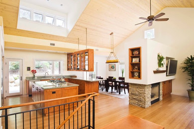 Mid-sized trendy u-shaped bamboo floor eat-in kitchen photo in Santa Barbara with shaker cabinets, medium tone wood cabinets, stainless steel appliances and an island
