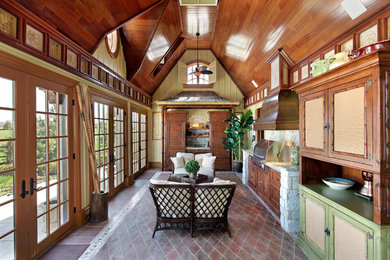Exempel på ett avskilt, mellanstort exotiskt linjärt kök, med skåp i mellenmörkt trä, granitbänkskiva, flerfärgad stänkskydd, stänkskydd i stenkakel, klinkergolv i terrakotta, luckor med infälld panel och rostfria vitvaror