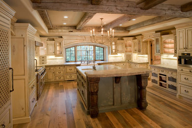 Inspiration for a huge mediterranean u-shaped medium tone wood floor eat-in kitchen remodel in San Francisco with a farmhouse sink, beaded inset cabinets, distressed cabinets, concrete countertops, white backsplash, stone tile backsplash, an island and stainless steel appliances