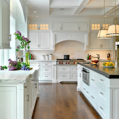 Kitchen - traditional kitchen idea in Boston with a farmhouse sink, marble countertops, white cabinets, beaded inset cabinets, white backsplash and subway tile backsplash