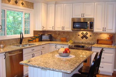 Example of a mid-sized classic l-shaped light wood floor open concept kitchen design in DC Metro with a double-bowl sink, raised-panel cabinets, white cabinets, granite countertops, beige backsplash, stainless steel appliances and an island
