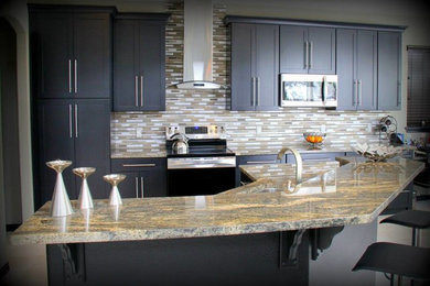 Example of a large classic galley ceramic tile kitchen design in Denver with a drop-in sink, recessed-panel cabinets, dark wood cabinets, granite countertops, multicolored backsplash, stainless steel appliances and an island