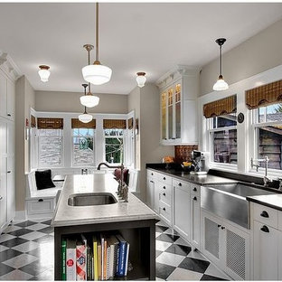 Large contemporary eat-in kitchen photos - Example of a large trendy galley porcelain tile and multicolored floor eat-in kitchen design in Phoenix with a farmhouse sink, shaker cabinets, white cabinets, solid surface countertops, metallic backsplash, ceramic backsplash, stainless steel appliances and an island