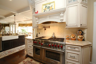 Large elegant u-shaped dark wood floor and brown floor open concept kitchen photo in New York with recessed-panel cabinets, white cabinets, granite countertops and an island