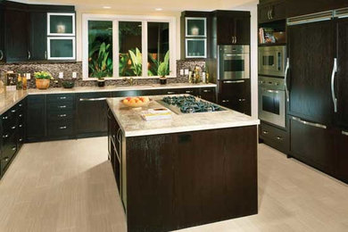 Example of a large trendy u-shaped ceramic tile and beige floor enclosed kitchen design in Other with an undermount sink, shaker cabinets, dark wood cabinets, granite countertops, multicolored backsplash, mosaic tile backsplash, stainless steel appliances and an island