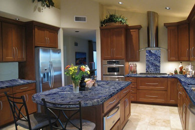 Kitchen - kitchen idea in Other with recessed-panel cabinets, medium tone wood cabinets, stainless steel appliances and an island