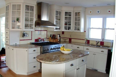 Inspiration for a mid-sized u-shaped light wood floor open concept kitchen remodel in Providence with a double-bowl sink, shaker cabinets, white cabinets, granite countertops, beige backsplash, ceramic backsplash, stainless steel appliances and an island