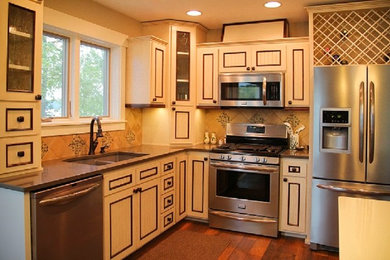 Example of a mid-sized mountain style l-shaped dark wood floor eat-in kitchen design in Minneapolis with an undermount sink, beaded inset cabinets, white cabinets, laminate countertops, beige backsplash, ceramic backsplash, stainless steel appliances and an island