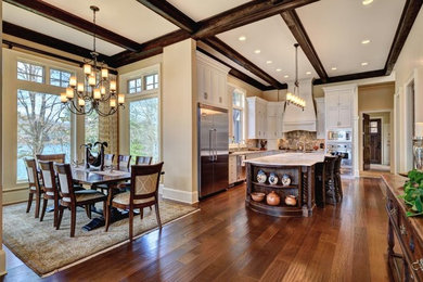 Example of a large classic single-wall medium tone wood floor open concept kitchen design in Other with an undermount sink, shaker cabinets, white cabinets, marble countertops, multicolored backsplash, porcelain backsplash, stainless steel appliances and an island