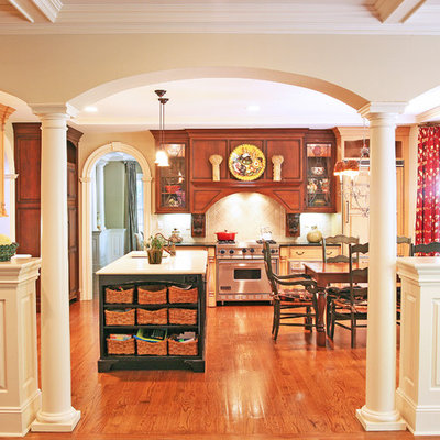 Elegant eat-in kitchen photo in Other with medium tone wood cabinets and stainless steel appliances
