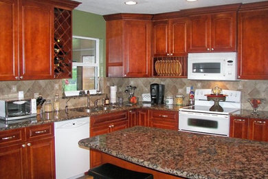 Kitchen - mid-sized u-shaped ceramic tile kitchen idea in Tampa with medium tone wood cabinets, granite countertops, beige backsplash, terra-cotta backsplash, white appliances and an island