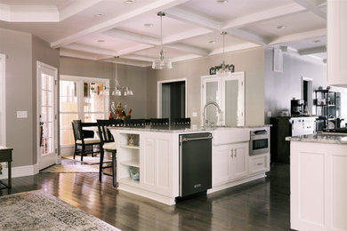 Large elegant single-wall medium tone wood floor, gray floor and coffered ceiling eat-in kitchen photo in Atlanta with a double-bowl sink, shaker cabinets, white cabinets, quartzite countertops, gray backsplash, porcelain backsplash, stainless steel appliances, an island and gray countertops