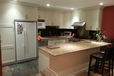 Open concept kitchen - mid-sized modern u-shaped slate floor open concept kitchen idea in Vancouver with an undermount sink, shaker cabinets, white cabinets, quartz countertops, brown backsplash, ceramic backsplash and a peninsula