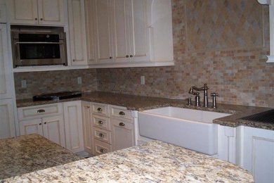 Design ideas for a classic kitchen in Other with white cabinets and granite worktops.