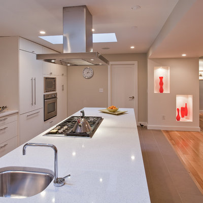 Trendy open concept kitchen photo in Vancouver with stainless steel appliances, an undermount sink, flat-panel cabinets, white cabinets, multicolored backsplash and mosaic tile backsplash