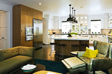 This is an example of a contemporary u-shaped kitchen in Charlotte with a submerged sink, flat-panel cabinets and an island.