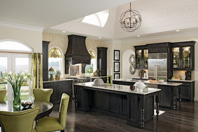 Example of a large transitional l-shaped dark wood floor and brown floor eat-in kitchen design in Richmond with an undermount sink, shaker cabinets, black cabinets, granite countertops, beige backsplash, stainless steel appliances and two islands