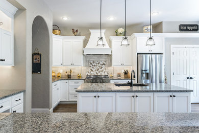 Inspiration for a transitional kitchen remodel in Denver with an island