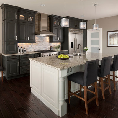 Inspiration for a large transitional galley dark wood floor kitchen remodel in Other with an undermount sink, raised-panel cabinets, gray cabinets, matchstick tile backsplash, stainless steel appliances, beige backsplash, an island and quartz countertops