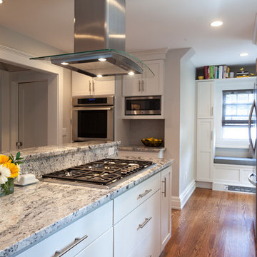 L-Shaped Kitchen with Center Island Hood and Stovetop