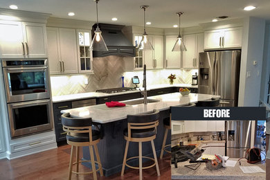 Inspiration for a mid-sized transitional l-shaped medium tone wood floor and brown floor eat-in kitchen remodel in New York with an undermount sink, recessed-panel cabinets, white cabinets, quartz countertops, gray backsplash, matchstick tile backsplash, stainless steel appliances and an island