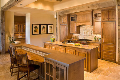Inspiration for a mid-sized rustic galley eat-in kitchen remodel in Albuquerque with raised-panel cabinets and medium tone wood cabinets