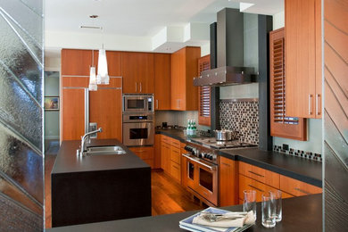 Mid-sized trendy u-shaped dark wood floor eat-in kitchen photo in San Diego with a double-bowl sink, flat-panel cabinets, dark wood cabinets, multicolored backsplash, mosaic tile backsplash, stainless steel appliances and an island