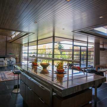 Lac La Belle - Modern Brick Lake Home Kitchen, Living Room and Dining Room with