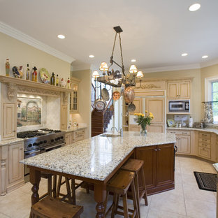 Example of a french country kitchen design in Chicago with an integrated sink, recessed-panel cabinets, beige cabinets, beige backsplash and paneled appliances
