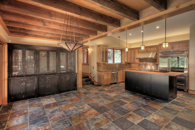 Inspiration for a mid-sized rustic l-shaped slate floor and multicolored floor eat-in kitchen remodel in Sacramento with an undermount sink, shaker cabinets, medium tone wood cabinets, quartz countertops, beige backsplash, subway tile backsplash, stainless steel appliances and an island