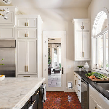 Lake Austin Kitchen with White Cabinets, Black Island