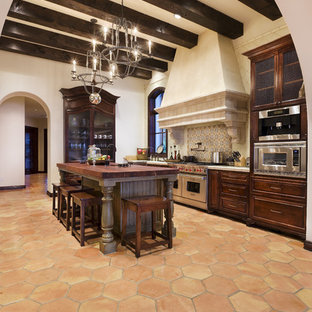 Inspiration for a rustic kitchen in Austin with stainless steel appliances.