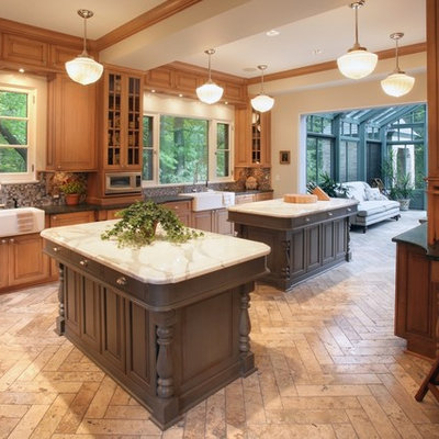 Elegant kitchen photo in Milwaukee with mosaic tile backsplash, a farmhouse sink and marble countertops