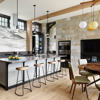 Trendy eat-in kitchen photo in Chicago with white backsplash