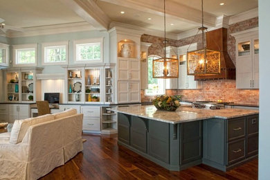 Large transitional u-shaped medium tone wood floor open concept kitchen photo in Charlotte with an island, recessed-panel cabinets, white cabinets, granite countertops, red backsplash and stainless steel appliances