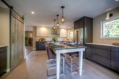 Example of a mid-sized trendy u-shaped porcelain tile and gray floor eat-in kitchen design in Portland with an undermount sink, shaker cabinets, brown cabinets, quartz countertops, white backsplash, subway tile backsplash, stainless steel appliances, an island and white countertops