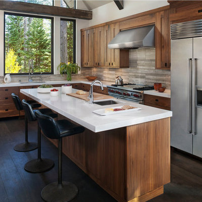 Mountain style kitchen photo in San Francisco with an undermount sink, flat-panel cabinets, beige backsplash, stainless steel appliances and medium tone wood cabinets