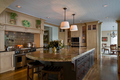 Example of a classic medium tone wood floor kitchen design in New York with recessed-panel cabinets, light wood cabinets, granite countertops, metallic backsplash, metal backsplash and paneled appliances
