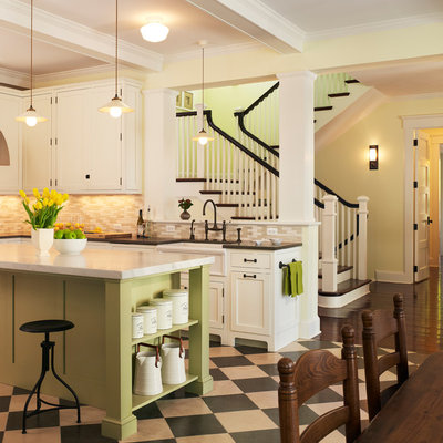 Example of a beach style linoleum floor kitchen design in DC Metro with beige backsplash, white cabinets, recessed-panel cabinets and a farmhouse sink