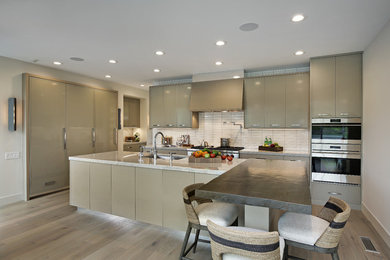 Example of a large minimalist l-shaped light wood floor and beige floor open concept kitchen design in Chicago with an undermount sink, flat-panel cabinets, gray cabinets, marble countertops, white backsplash, ceramic backsplash, stainless steel appliances, an island and white countertops